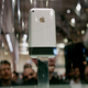 An iPhone sits behind a glass case in 2007.